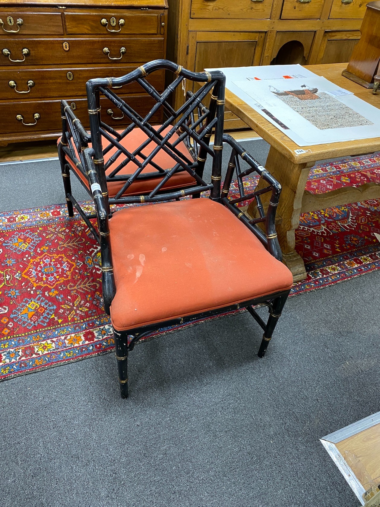 A pair of Regency style lacquer lattice back elbow chairs (one a.f.), width 56cm, depth 49cm, height 94cm